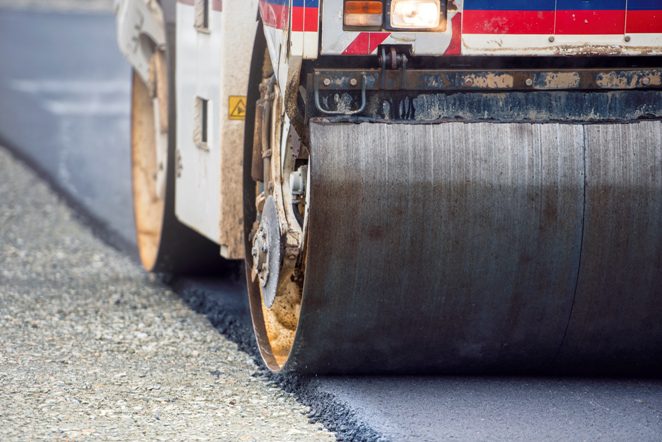 Heavy Vibration roller compactor at asphalt pavement works for road and highway construction